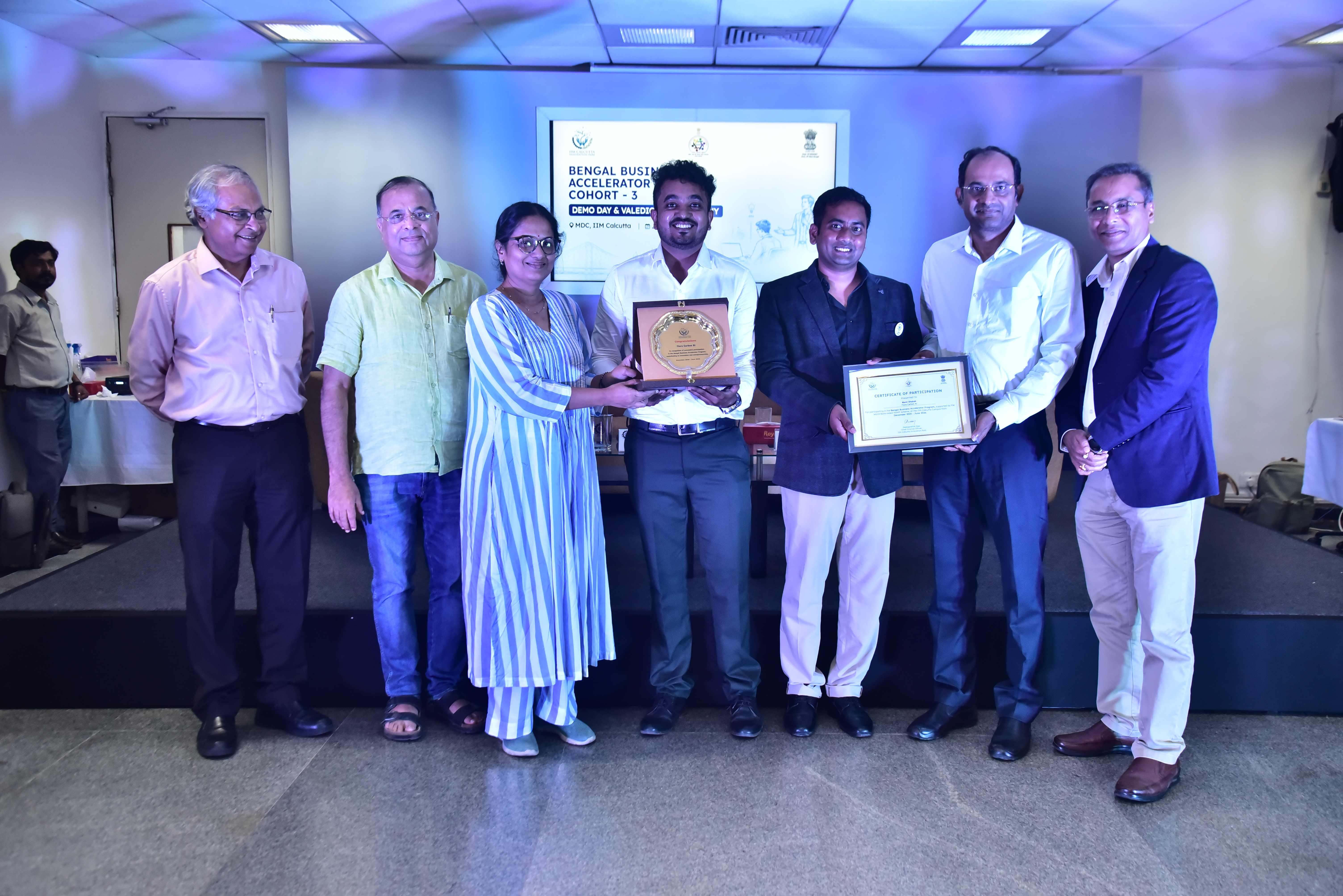 Flora Carbon AI team on stage at IIM Calcutta during Demo Day