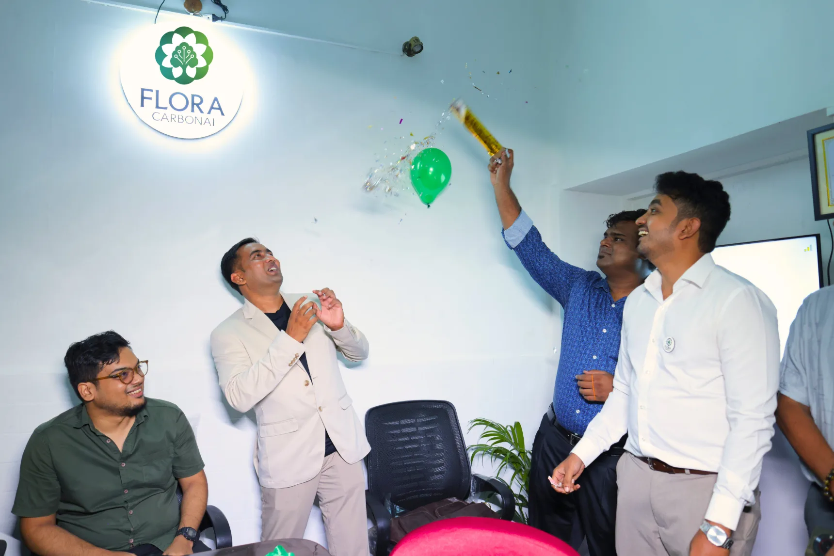 Full team celebrating the milestone